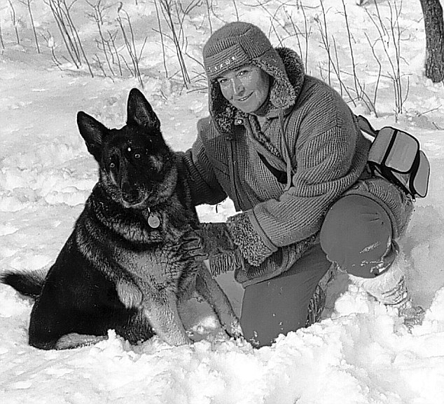 A grown Misha Defonseca with her dog