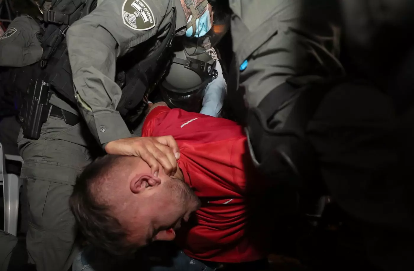 Israeli police detain a Palestinian protester