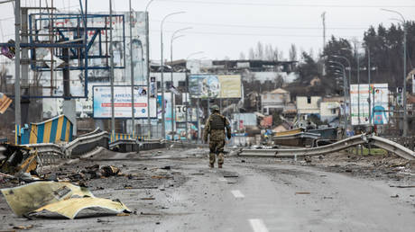 Lone soldier standing in the remains of Bucha