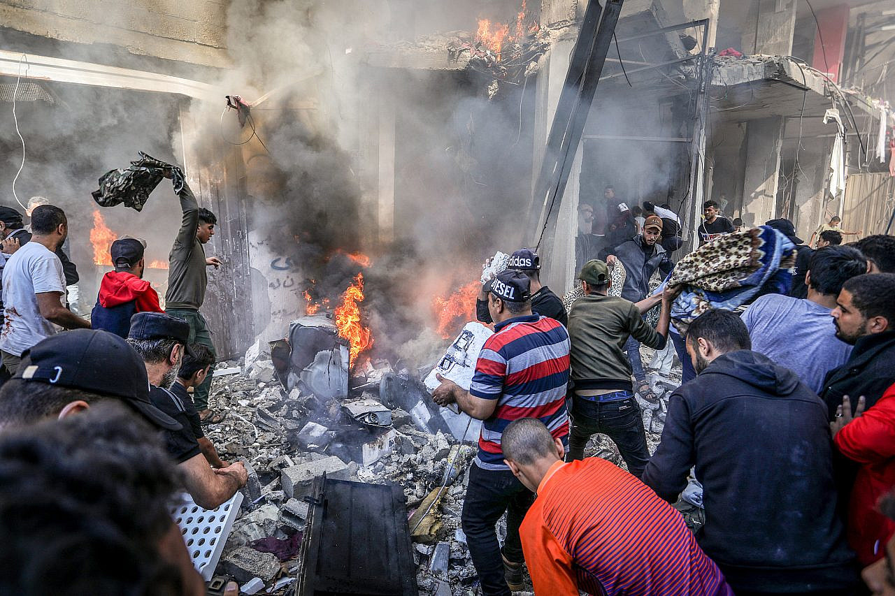 Palestinians try to put out a fire